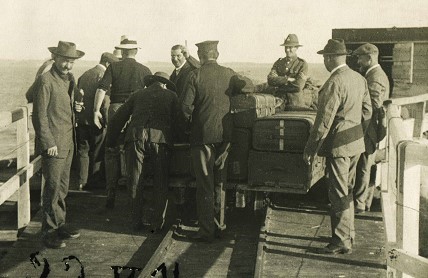 German internees from Samoa arriving at the wharf on Wharf Bay Beach, Motuihe
