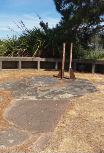 Gun emplacement on the headland with later flag pole bracket