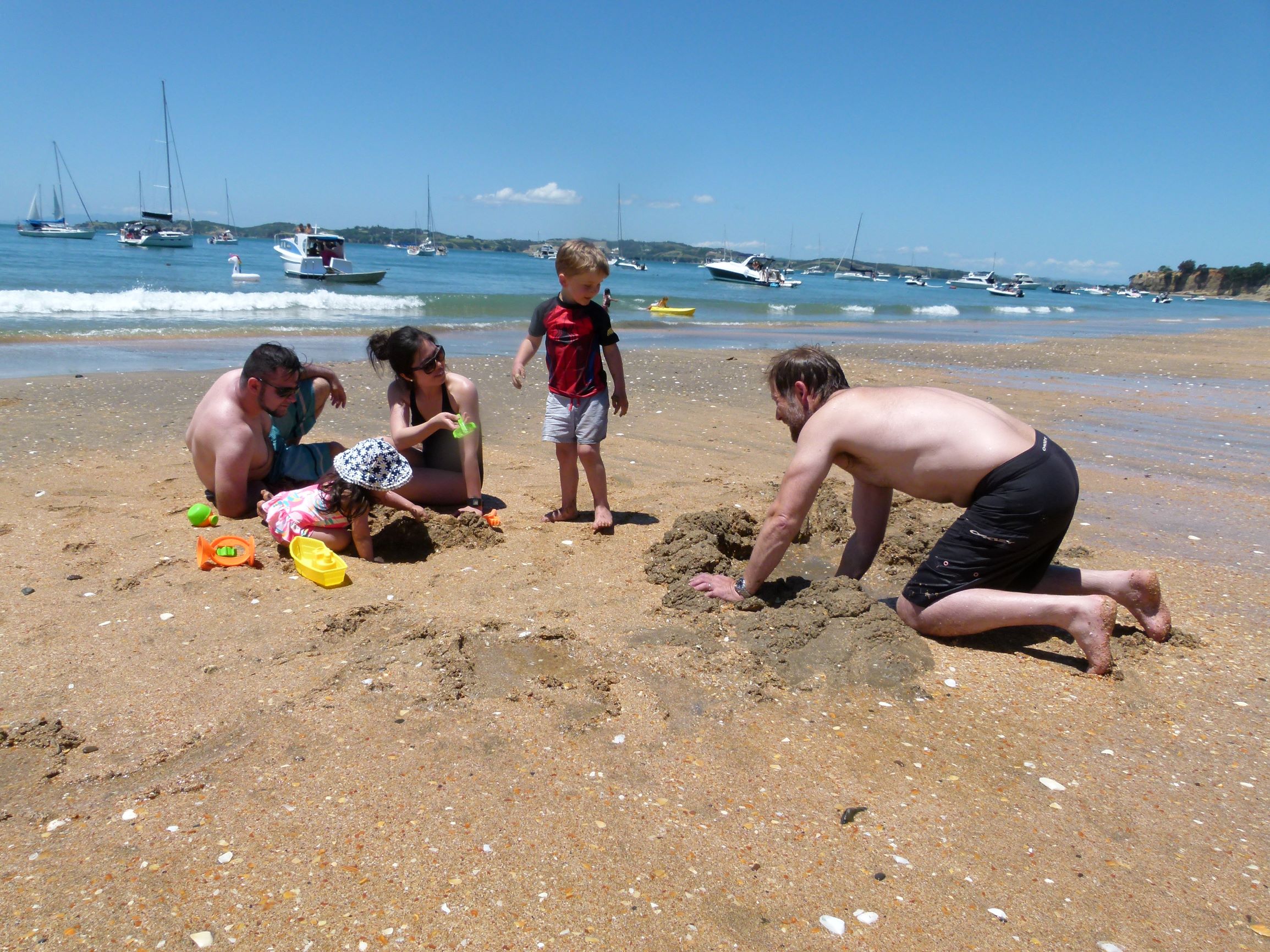 Families enjoying the beach on Motuihe Island