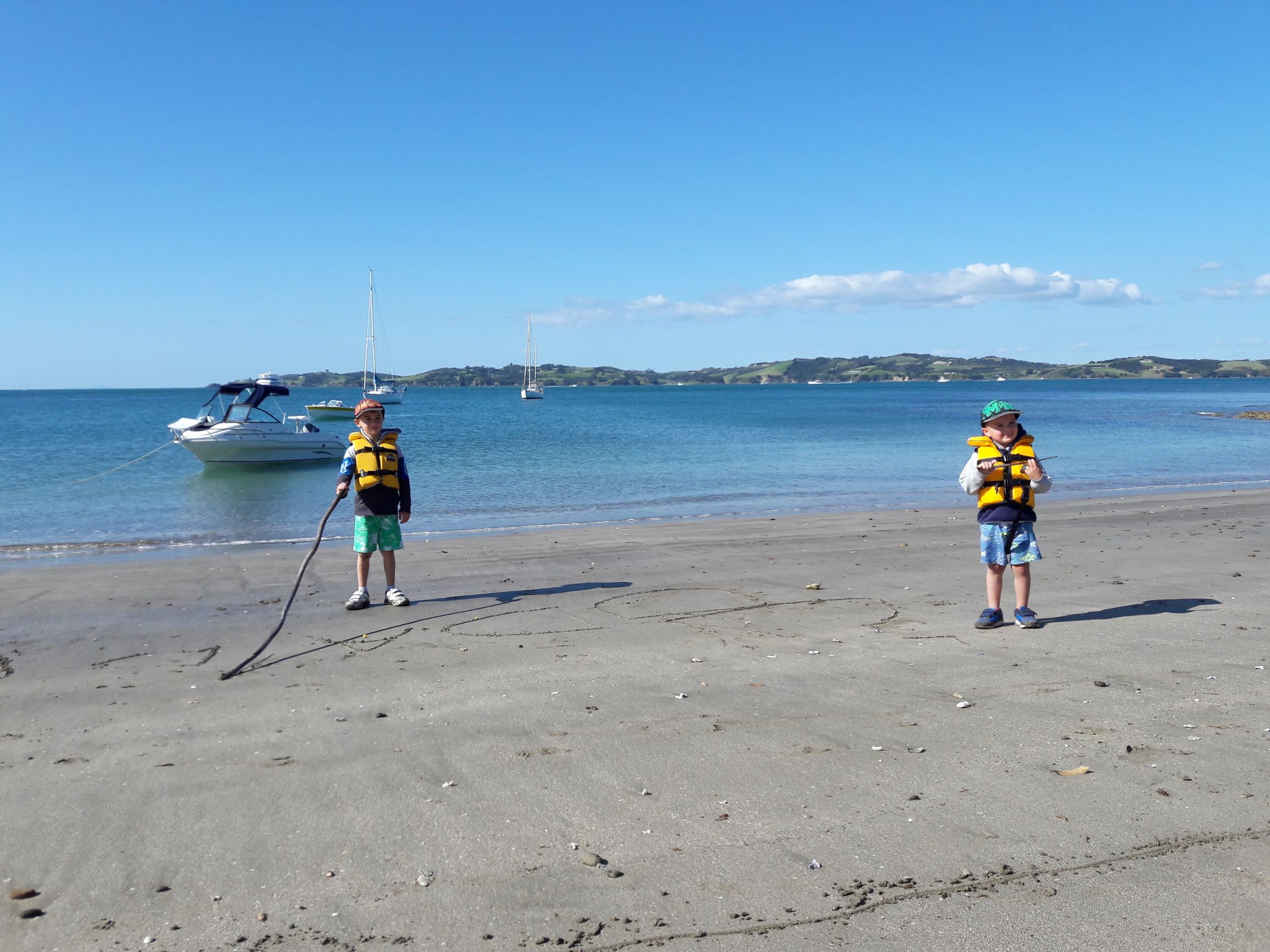 Children enjoying beach activities on Motuihe Island