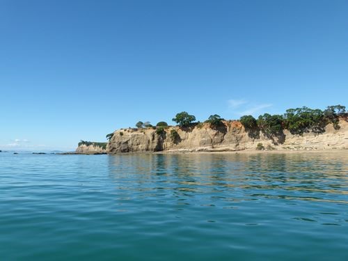 Geological soil layers visible on Motuihe Island coastline
